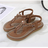 Sandali bassi da donna – Stile boho chic – Perline di legno – Cinturino intrecciato alla caviglia