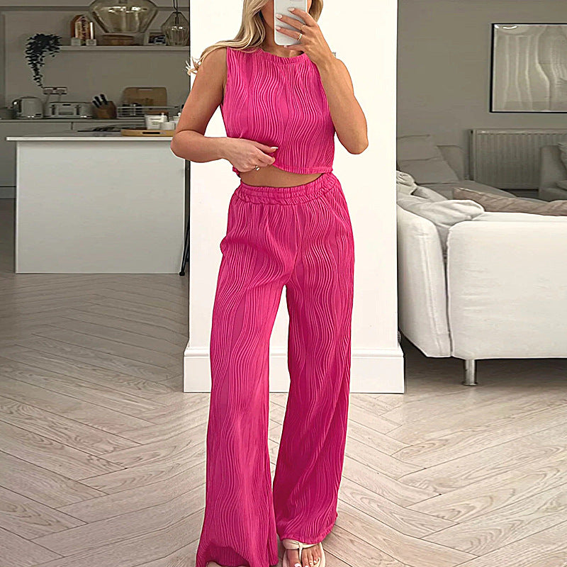 Completo due pezzi da donna: top corto aderente senza maniche, pantaloni dritti a vita alta