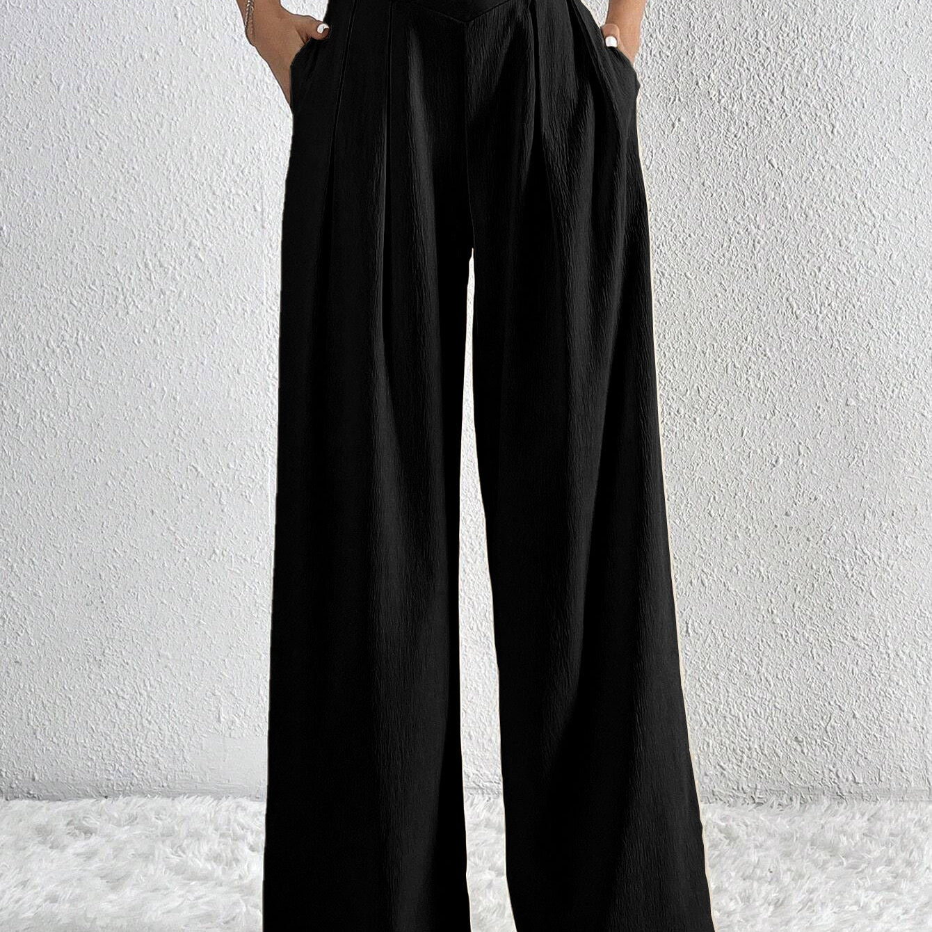 Pantaloni larghi da donna – Vita alta – Tessuto leggero – Taglio fluido con pieghe e tasche