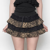 Minigonna con fiocco in pizzo a strati e stampa leopardata