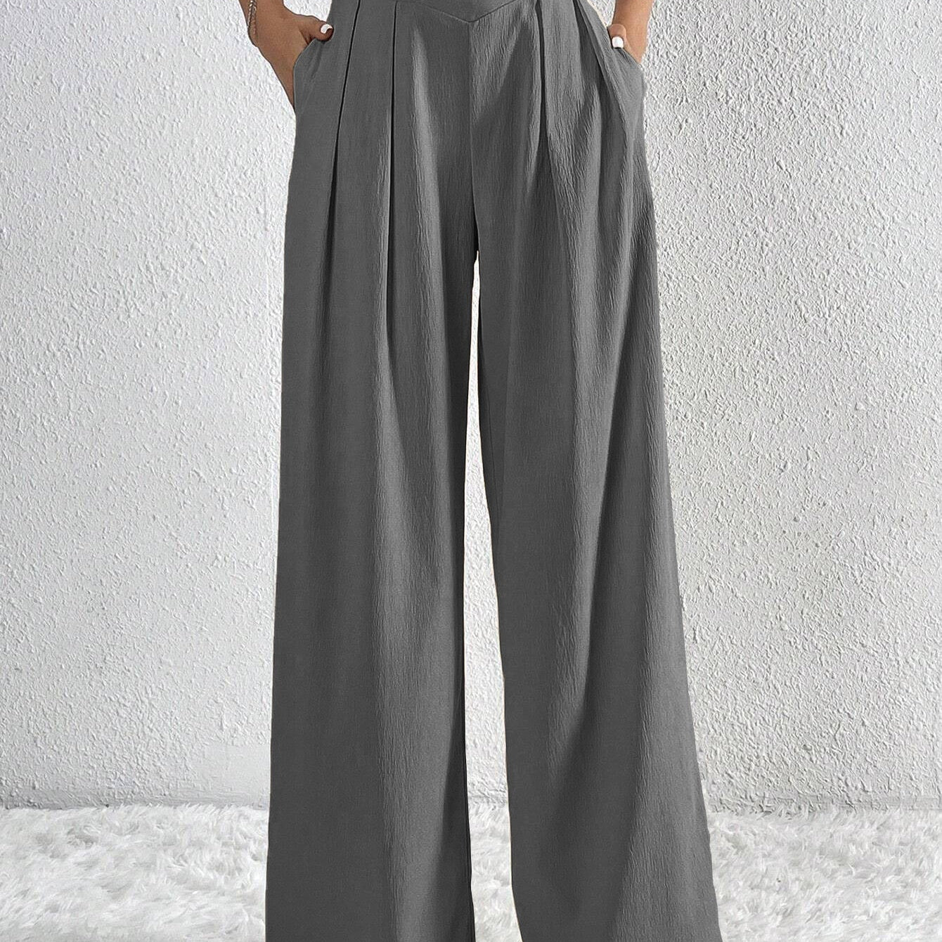 Pantaloni larghi da donna – Vita alta – Tessuto leggero – Taglio fluido con pieghe e tasche