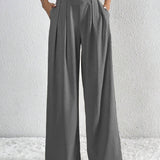 Pantaloni larghi da donna – Vita alta – Tessuto leggero – Taglio fluido con pieghe e tasche