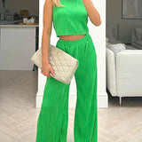 Completo due pezzi da donna: top corto aderente senza maniche, pantaloni dritti a vita alta