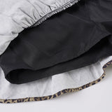 Minigonna con fiocco in pizzo a strati e stampa leopardata