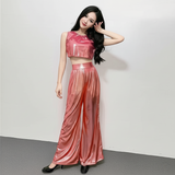 Completo composto da top corto metallizzato e pantaloni a gamba larga per donna