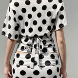 Completo due pezzi con top a pois e maniche a pipistrello