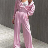 Completo da ufficio in due pezzi con pantaloni dritti e cerniera in maglia rosa