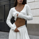 Completo due pezzi con gonna e top corto in maglia sexy