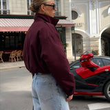 Giacca semplice, ampia e corta con collo alto