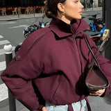 Giacca semplice, ampia e corta con collo alto