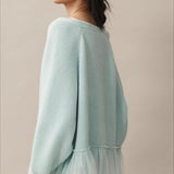Cardigan in maglia trasparente con volant