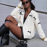 Cardigan in maglia a maniche lunghe con fiocco e scollo a V e blocchi di colore