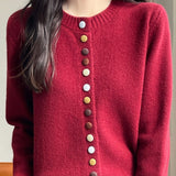 Cardigan in velluto tinta unita con bottoni colorati