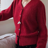 Cardigan con scollo a V, fiocco e bottoni