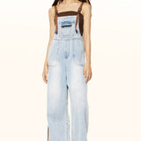 Jeans con bretelle a gamba larga lavati