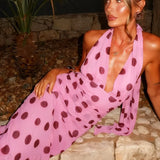 Abito lungo a pois con cintura in vita e schiena scoperta