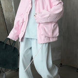 Giacca con tasca portaoggetti e coulisse in vita