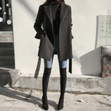 Soprabito nero in misto lana con lacci