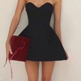 Mini abito nero sexy aderente senza spalline e senza schienale