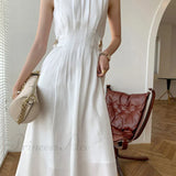 Abito midi alla moda con maniche lunghe e bottoni