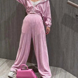 Completo da ufficio in due pezzi con pantaloni dritti e cerniera in maglia rosa