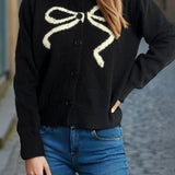 Cardigan rotondo jacquard con fiocco solido