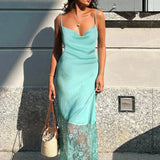 Abito lungo aderente con schiena scoperta in pizzo