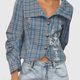 Cappotto con collo alto e arricciature a quadri con stampa a candelabro