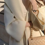 Elegante cappotto marrone in lana con cappuccio