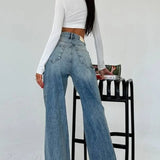 Jeans dritti a gamba larga e vita alta snellenti