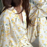 Completo due pezzi da salotto con cardigan a maniche lunghe e pantaloni floreali