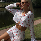 Completo due pezzi con gonna cardigan a maniche lunghe in raso stampato