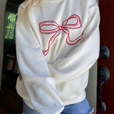 Blusa girocollo rilassata, dolce ed elegante