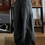 Pantaloni cargo larghi in denim lavato e rovinato