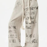 Jeans dritti in denim con graffiti color albicocca