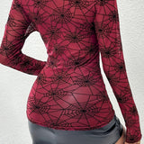 Blusa aderente in rete trasparente