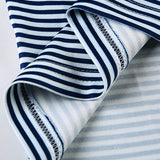 Blusa in maglia aderente a righe con scollo rotondo e schiena scoperta