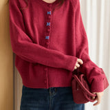 Cardigan con fibbia ricamata a scollo tondo