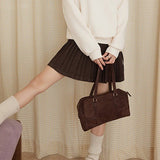 Gonna a vita alta plissettata in lana tinta unita