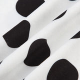 Completo due pezzi con top a pois e maniche a pipistrello