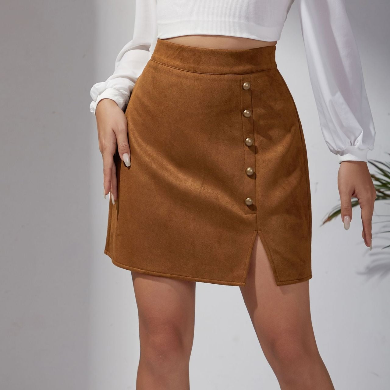 Minigonna aderente in pelle scamosciata tinta unita