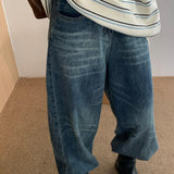 Jeans larghi a vita alta con baffo lavato vintage