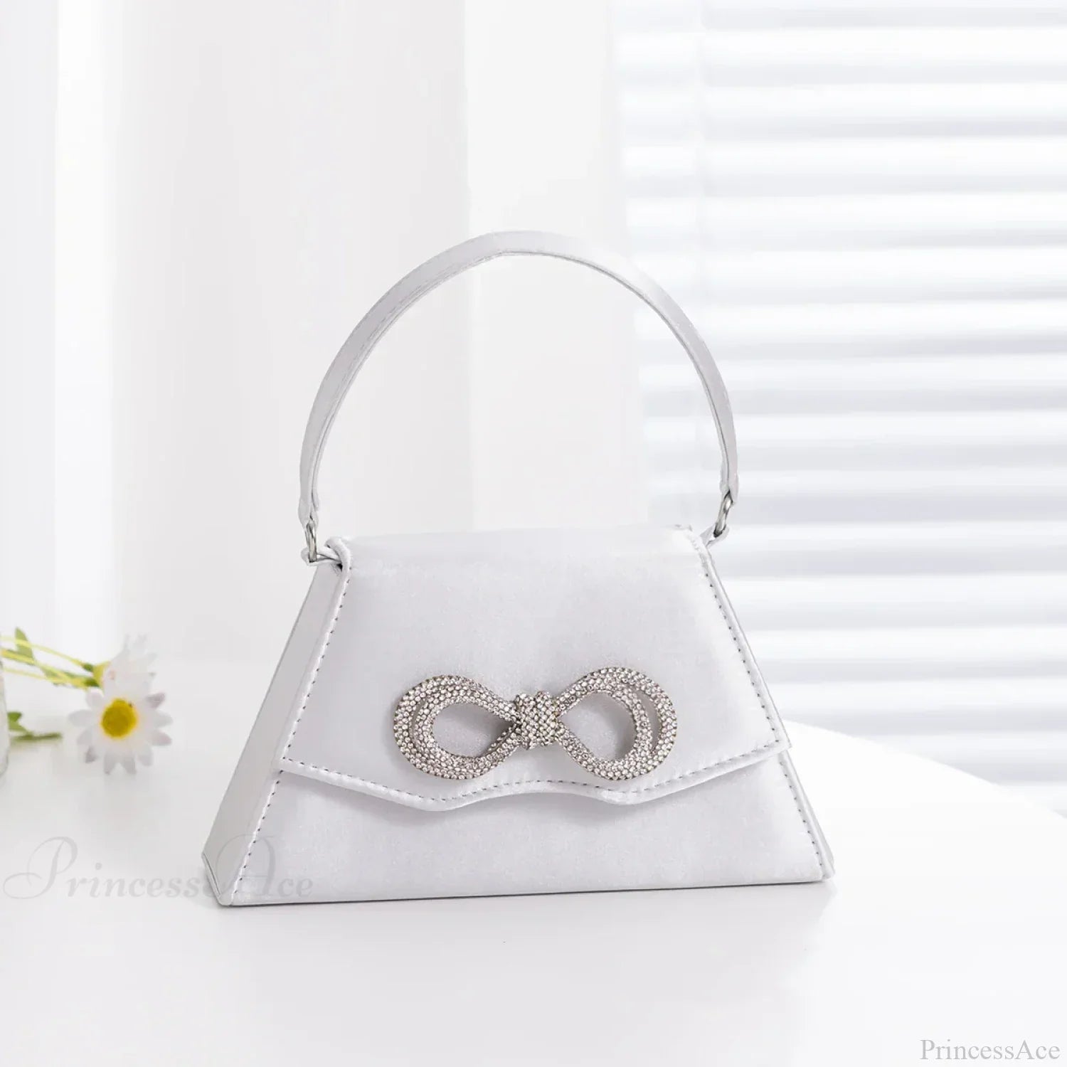 Elegante pochette da sposa con fiocco in seta e strass