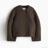 Elegante cappotto in lana tinta unita con un bottone