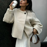 Elegante cappotto in lana tinta unita con un bottone