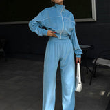 Completo sportivo in due pezzi con colletto in velluto e cerniera a maniche lunghe