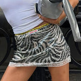 Gonna aderente con patchwork di pizzo e paillettes zebrate