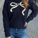 Cardigan rotondo jacquard con fiocco solido