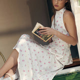 Completo due pezzi con gonna lunga e gilet con orlo a palloncino stampato in raso