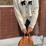 Cardigan a coste con fiocco scintillante